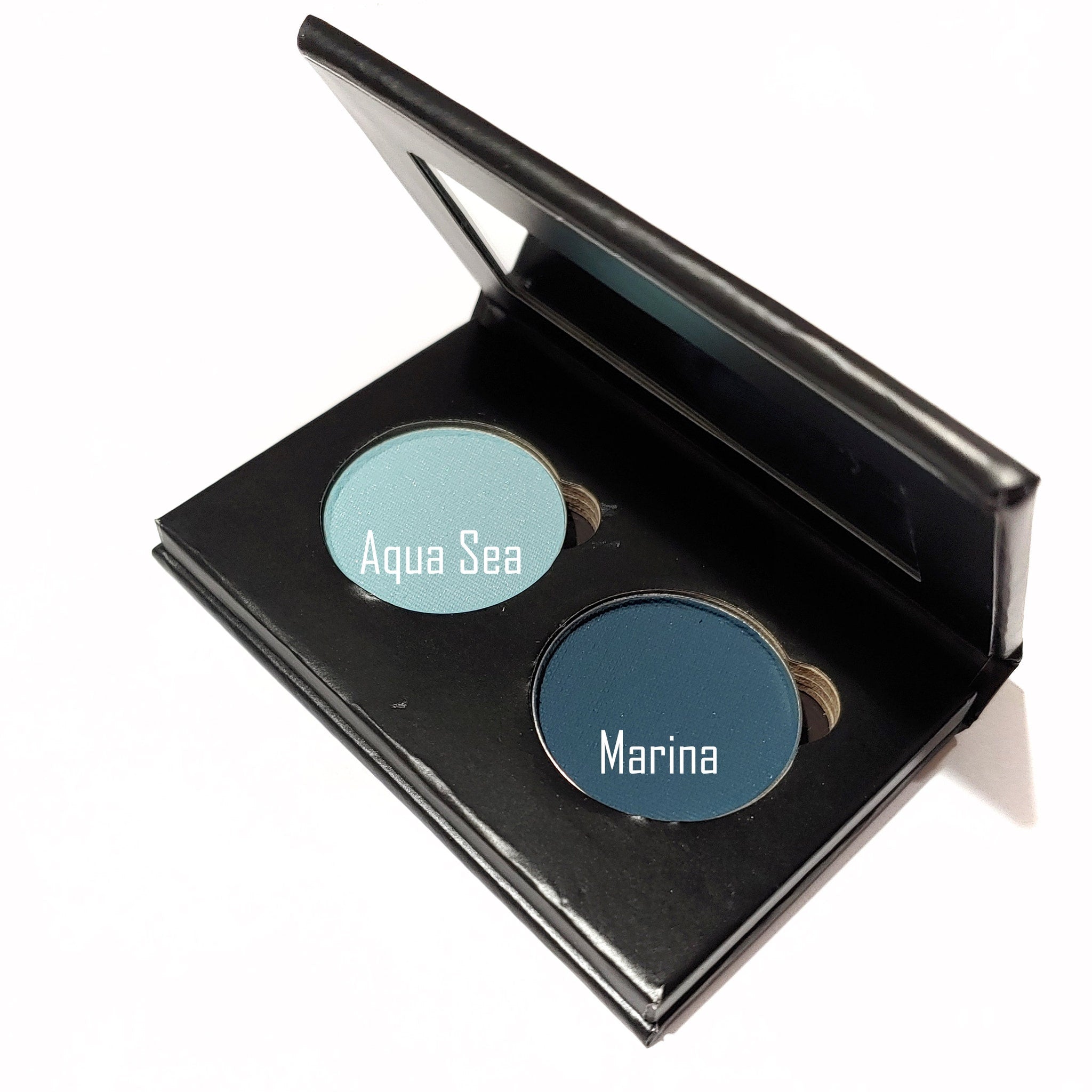 Eyeshadow palette with two shades, Aqua Sea and Marina, in a black compact with a mirror