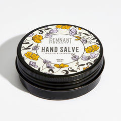 Hand salve tin, black metal container, floral pattern lid, Remnant Beauty UK text