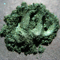 Side view of Vegan Halloween Snake Charmer Eye Shadow palette showing shimmering green and black shades in rectangular pans