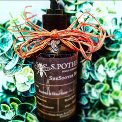 Soothe & Heal Bath bottle, dark brown glass, orange raffia bow, S.Pothe brand text visible