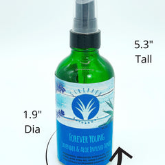 Toner bottle, green glass with black cap, blue and white label, "Stripped" brand name visible