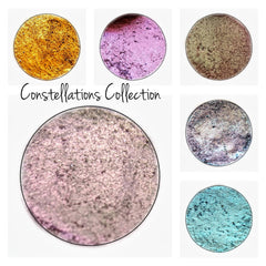 Close-up of multichrome pressed eyeshadow pan shifting from emerald green to gold with sparkling shimmer particles