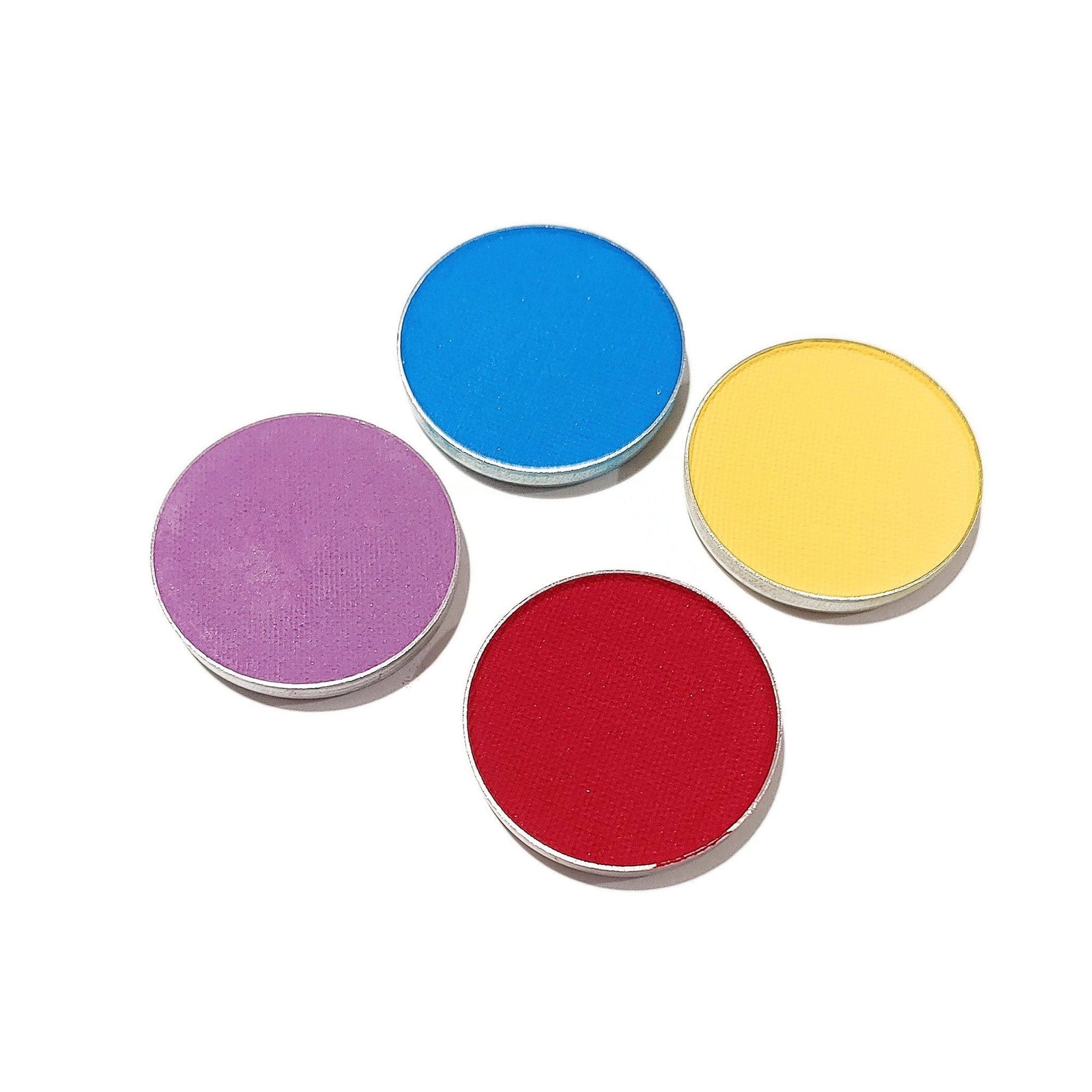 Eyeshadow palette with blue, yellow, red, and purple powder in round metal containers on white background