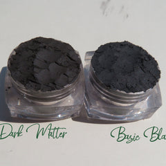 Hand applying matte dark brown vegan eyeshadow with a blending brush, showcasing smooth pigment application