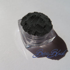 Side view of matte black and white vegan eyeshadow duo in sleek compact with dark mineral accents