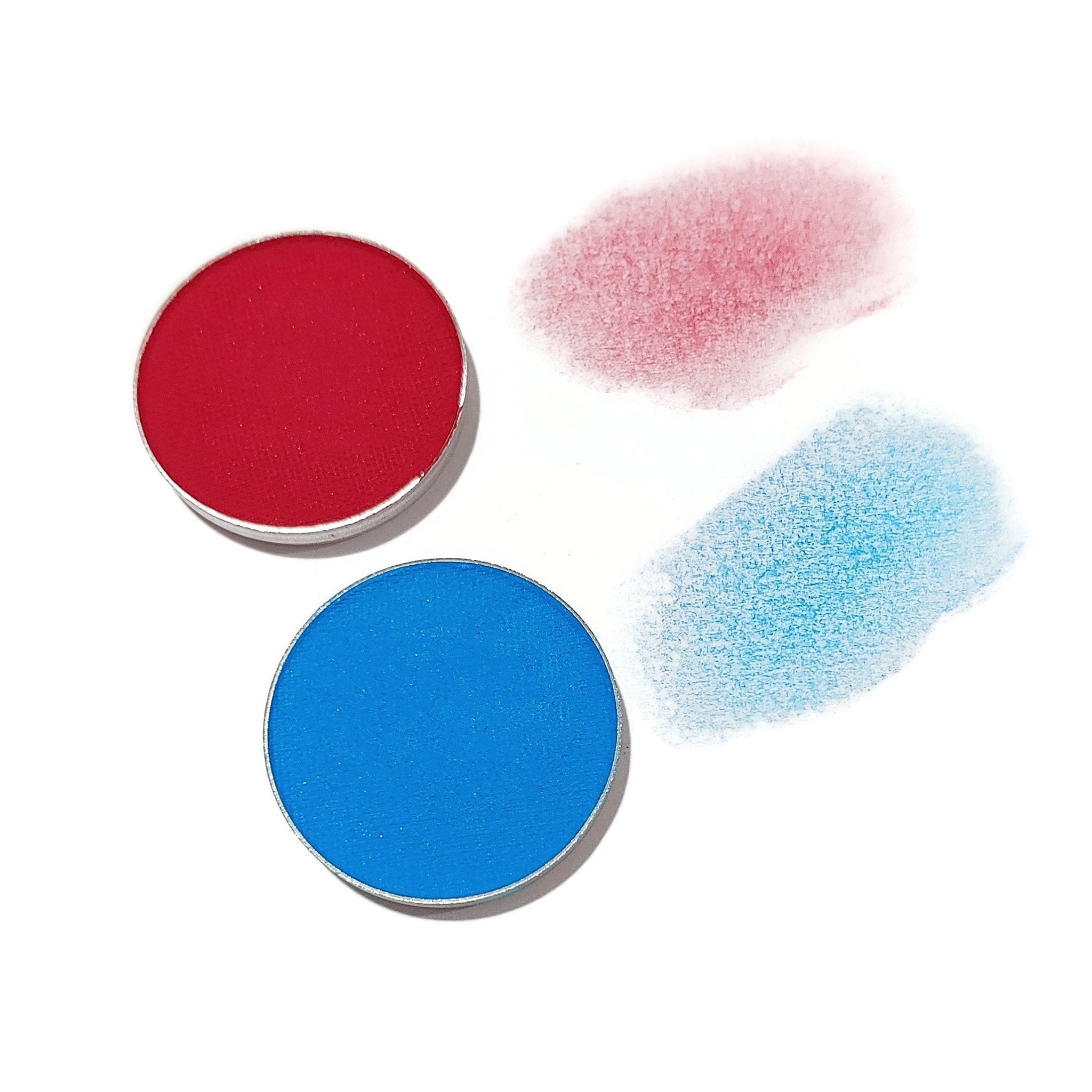 Eyeshadow pans with red and blue colors, with swatches of color on white background