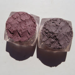 Hand applying matte brown vegan eyeshadow with brush, showcasing Truffles & Turtle Shell loose powder shades