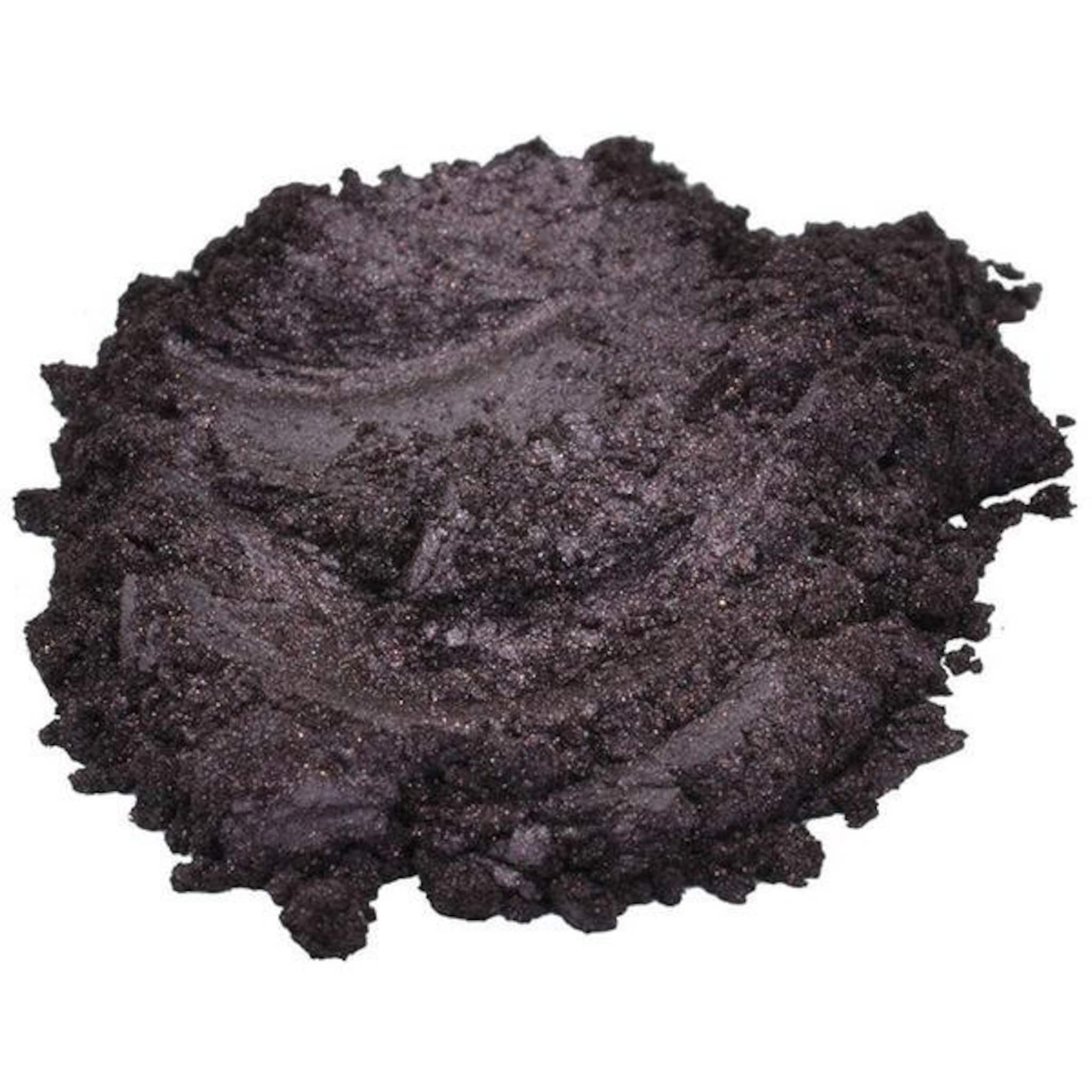 Dark purple powder with a textured, sparkly appearance, possibly pigment