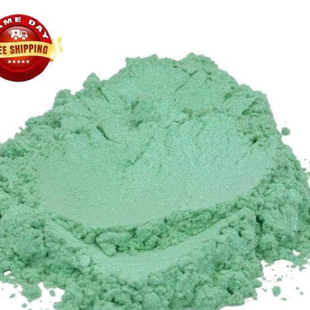 Vibrant green mica pigment powder in a small round jar with gold lid, shimmering under light