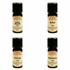 Hair oil bottles with black caps, Aromell brand, and various labels for essential oil blends