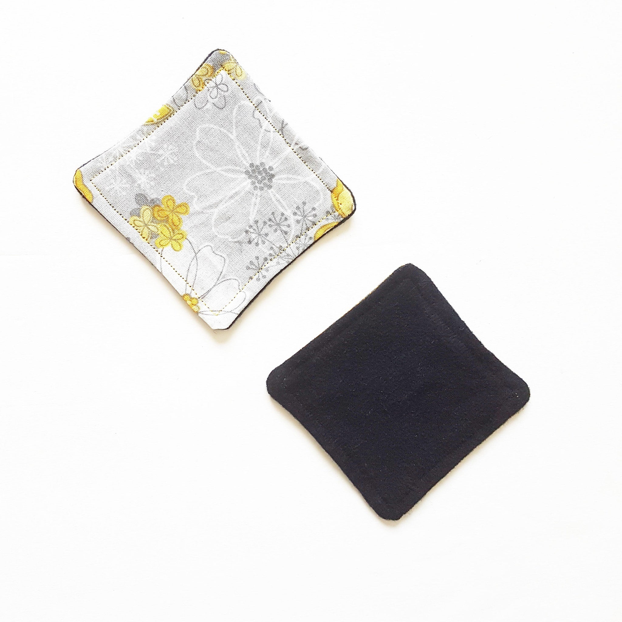 Reusable facial rounds, floral print and solid black fabric, diamond shape