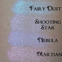 Side view of iridescent scarab green eyeshadow pan catching light with shimmering emerald undertones