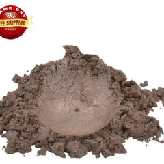 Close-up of luxurious brown mica pigment powder with shimmering moonstone sparkle in a sleek cosmetic jar