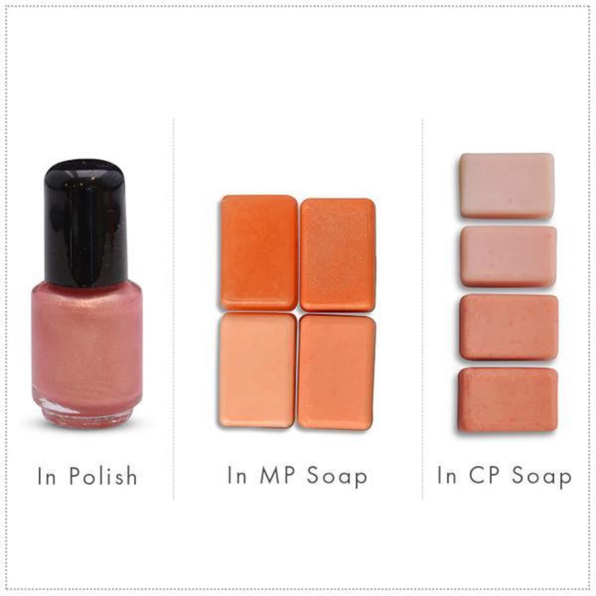 Nail polish bottle with pink metallic color and black cap, and soap bars in orange and pink hues