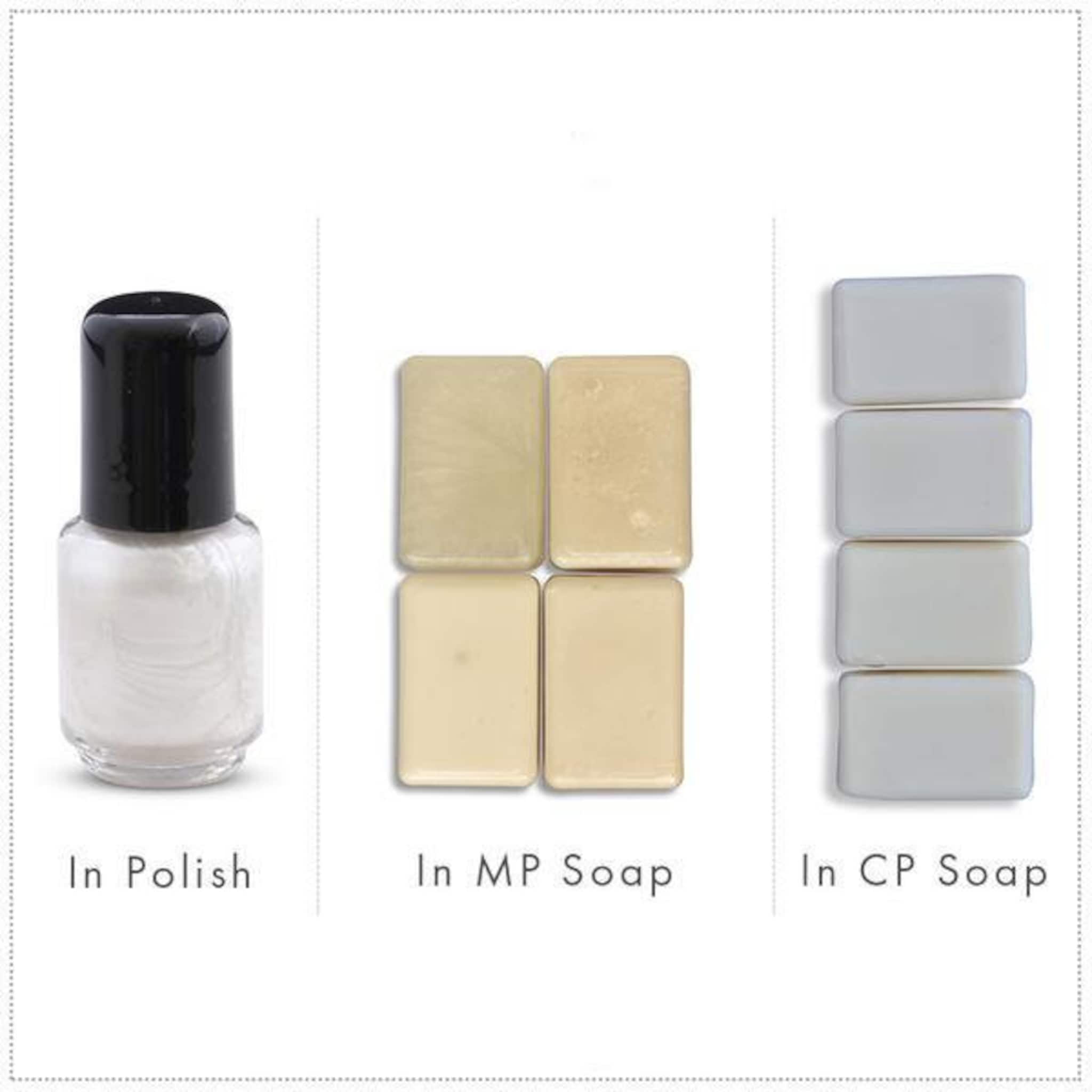 Nail polish bottle with black cap and white liquid, plus beige and grey soap bars