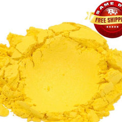 Vibrant yellow mica powder in a clear plastic jar with black screw-top lid, fine shimmering texture.