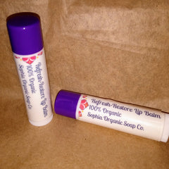 Lip balm tubes with purple caps, white tubes, and floral design, Sophia Organic Soap Co. brand visible
