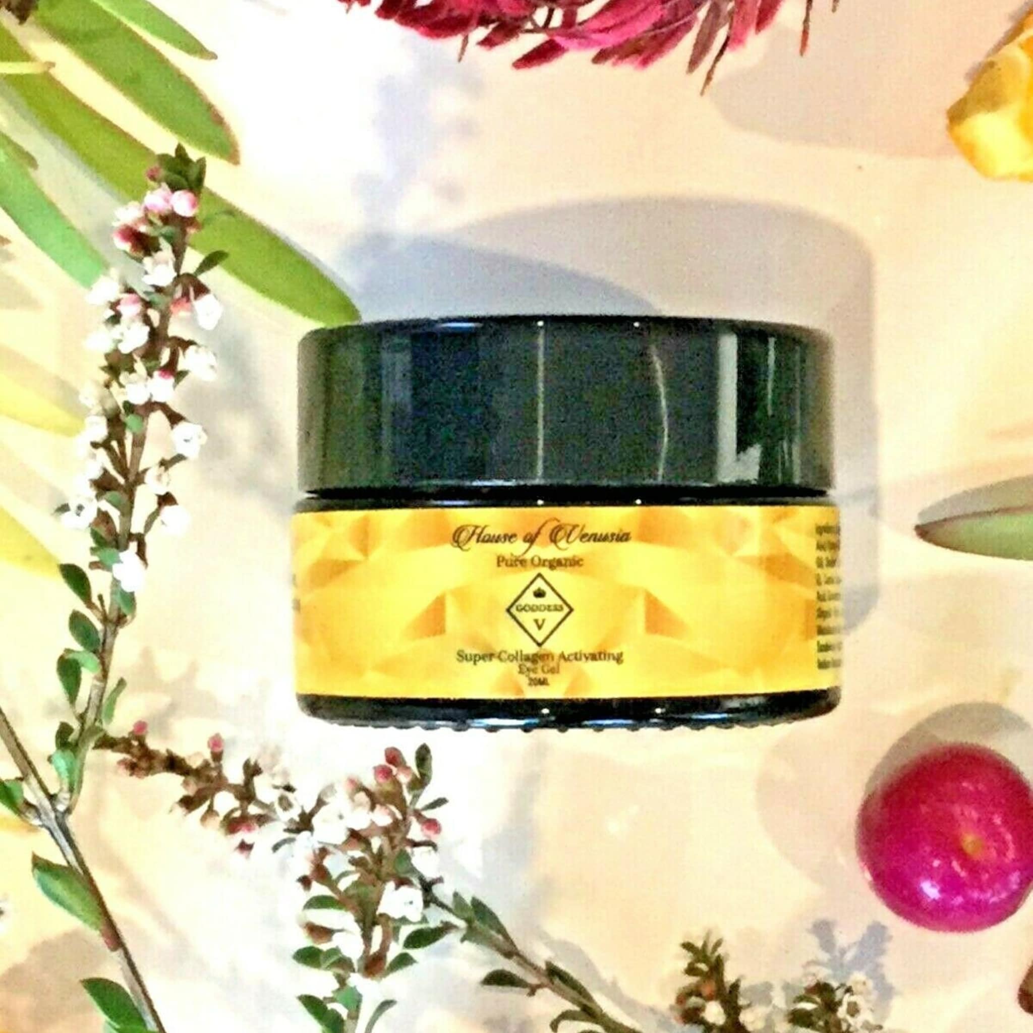Eye makeup jar, black and yellow, with text "House of Venusia" and floral arrangement