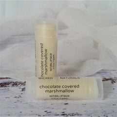 Lip balm tubes with white and black text on a light background, Wicked Naturals brand visible