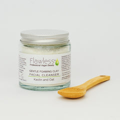 Facial cleanser jar with silver lid, glass container, and wooden spoon, Flawless brand visible