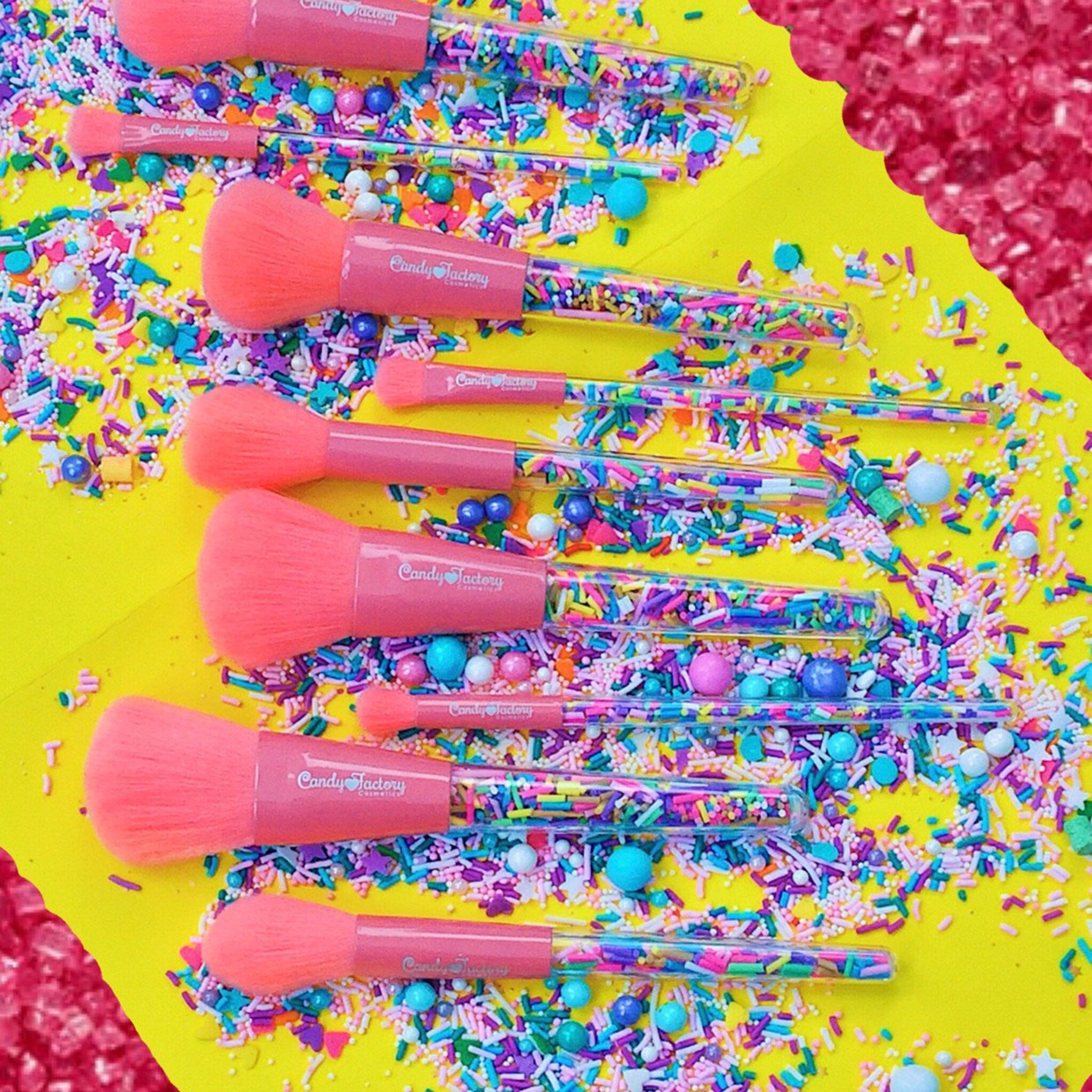 Side view of pastel-colored Sprinkle eyeshadow brushes with soft bristles in a standing display