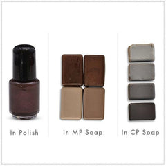 Nail polish bottle with dark brown liquid and black cap, next to brown soap samples