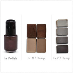 Nail polish bottle with brown liquid, black cap, and clear glass, next to soap samples