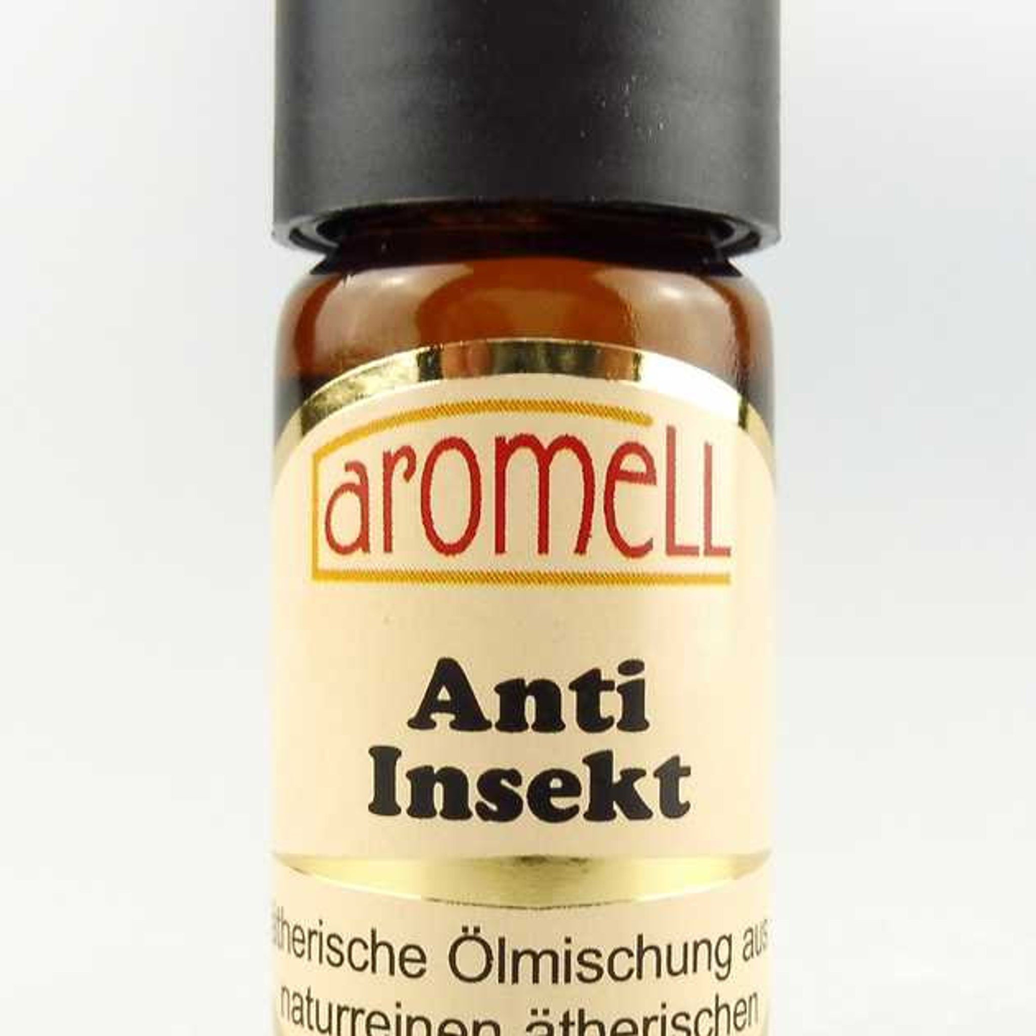 Aromell Anti Insekt bottle, brown glass bottle with black cap and cream label with gold trim and text