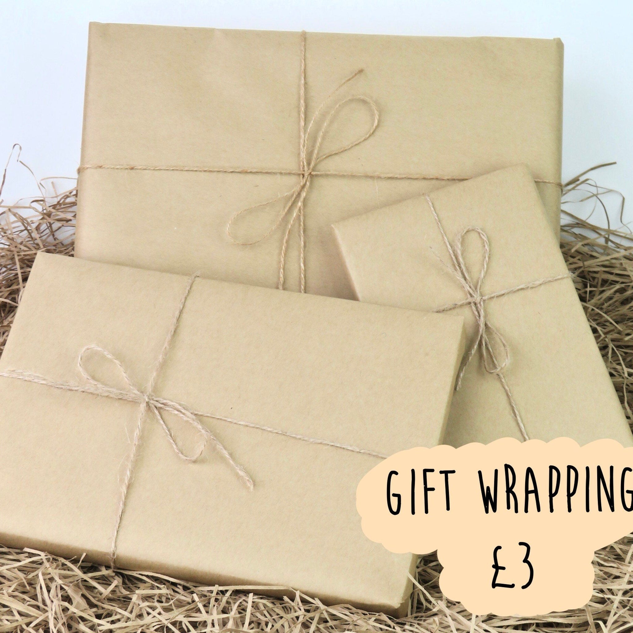 Gift wrapping, brown paper packages tied with twine, on straw bedding, for gifts