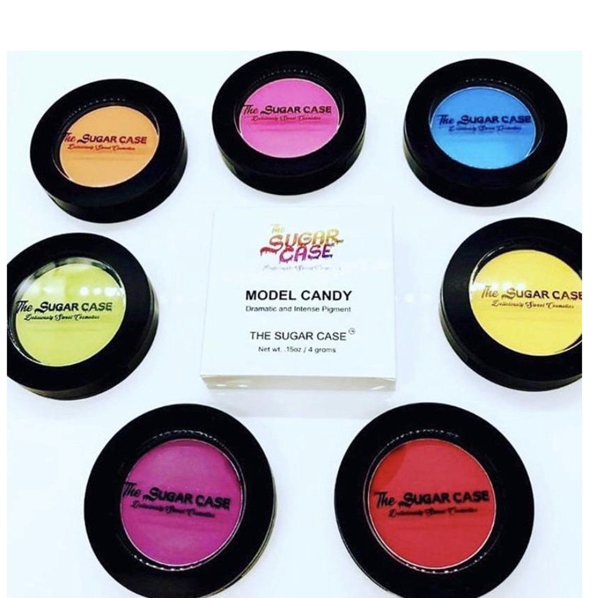Close-up of model applying vibrant pink Candy Eyeshadow to eyelid with fluffy brush