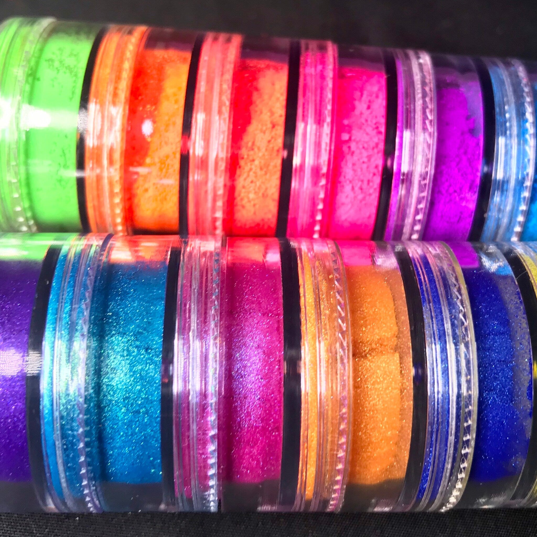 Bonus close-up of vegan mineral eyeshadow set showing ultra-bright matte and shimmery pigment stacks in vibrant colors