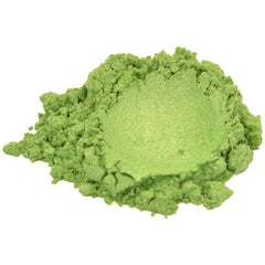 Side view of vibrant green mica powder in clear jar showing fine shimmering texture