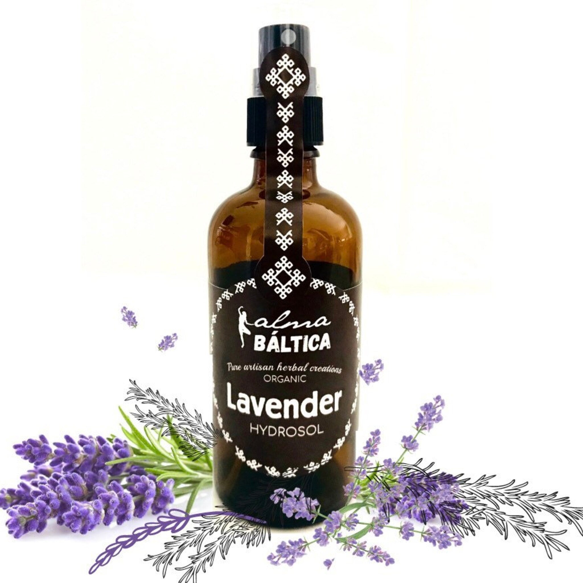 Lavender hydrosol bottle, brown glass bottle with black label and white text, with lavender flowers