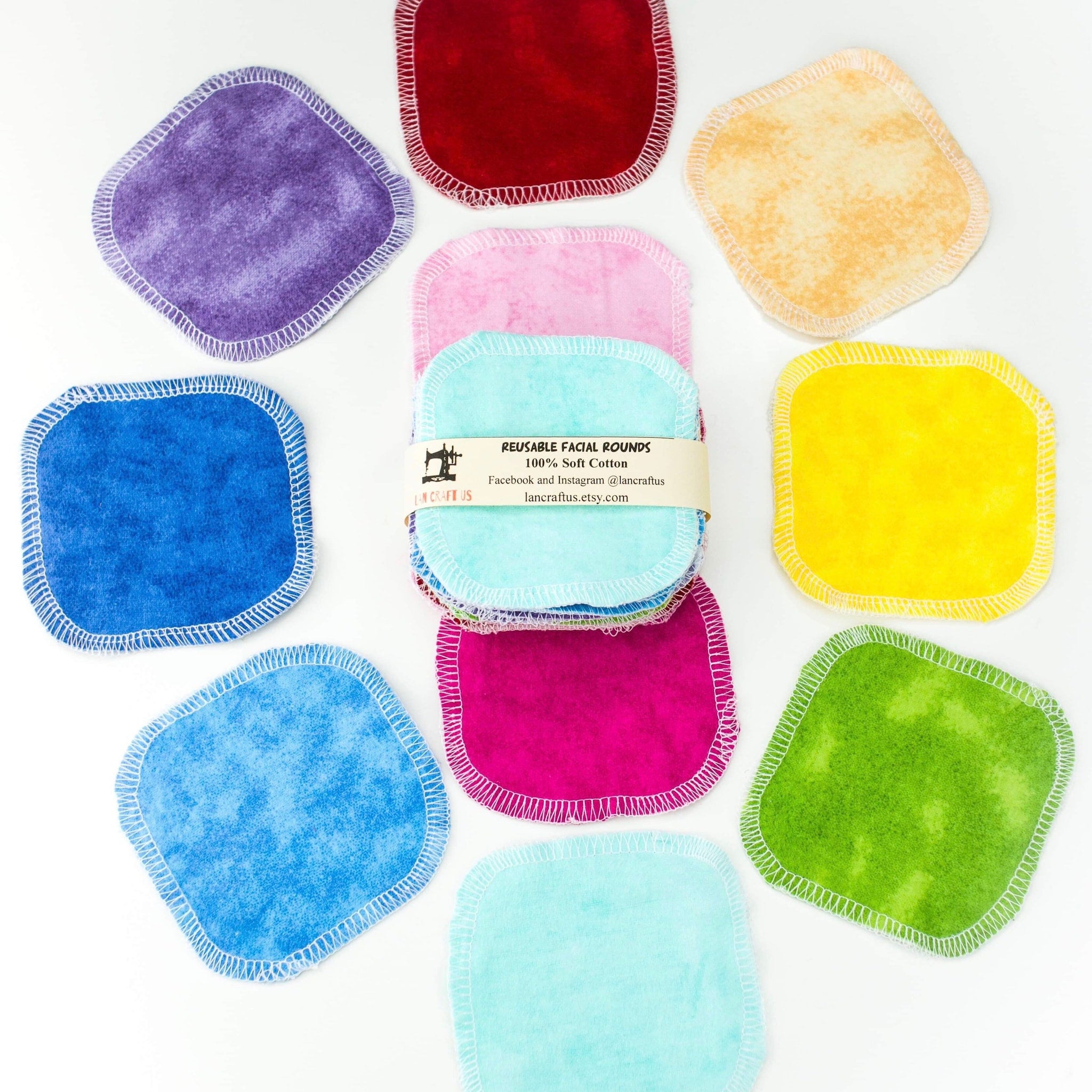 Reusable facial rounds in various colors with white stitching and LanCraftUS branding