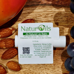 Lip balm tube with white label, NaturOils branding, and ingredients list on wooden surface