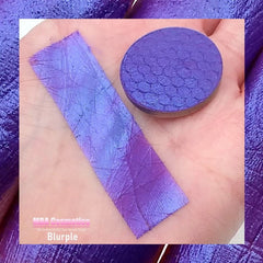 Close-up of duochrome blurple eyeshadow shifting between blue and purple with metallic sheen