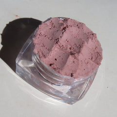 Close-up of matte medium pink loose mineral eye shadow with smooth powder texture in vegan, cruelty-free formula