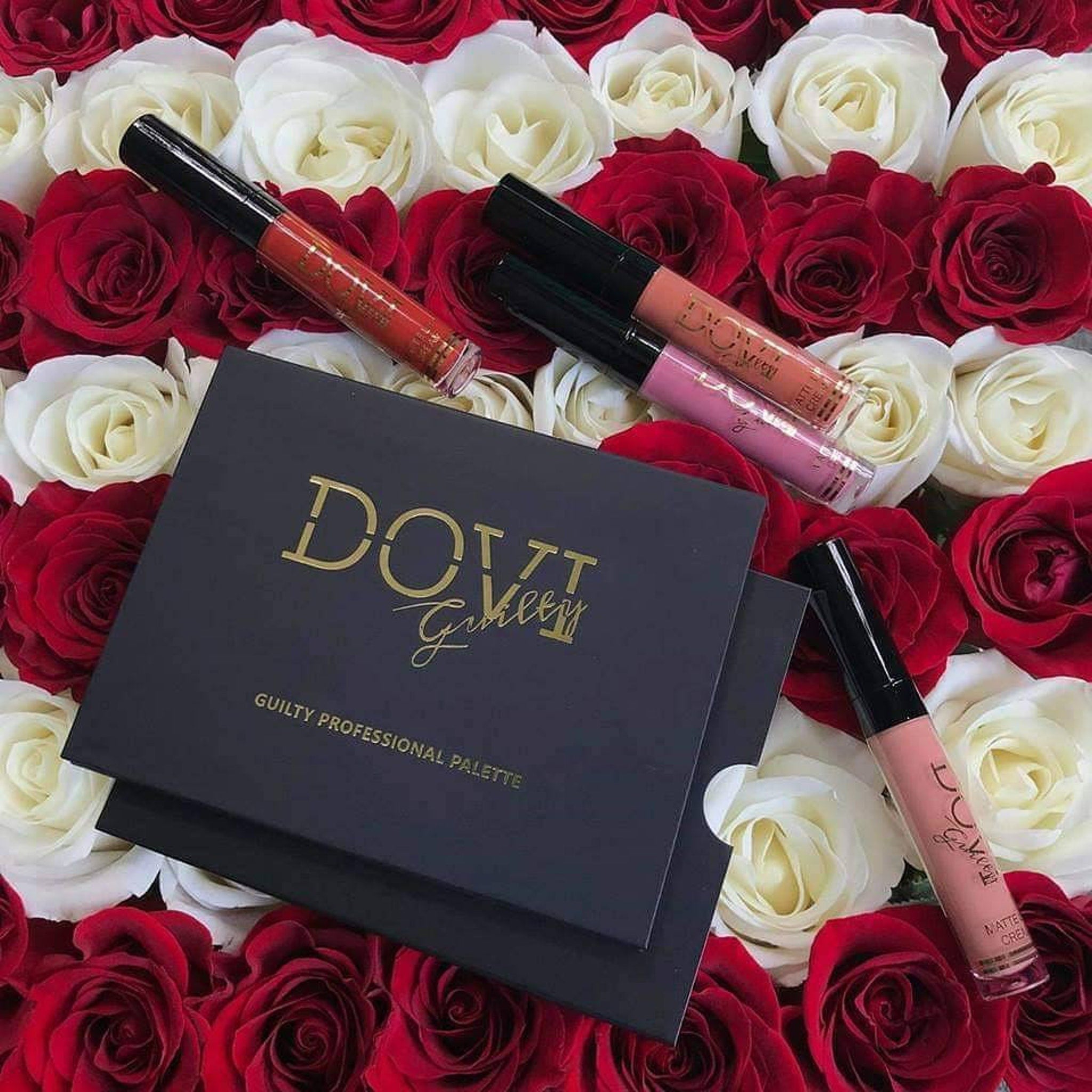 Close-up of Dovi Seattle Guilty eyeshadow palette showing shimmering bronze and deep plum shades with smooth texture