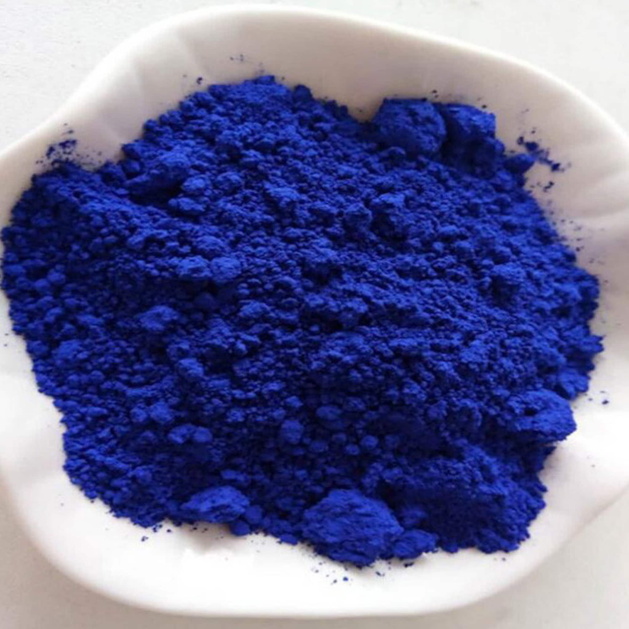 Blue powder in white dish, close-up view of textured powder, Mothers Lifestyle product