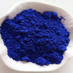 Blue powder in white dish, close-up view of textured powder, Mothers Lifestyle product