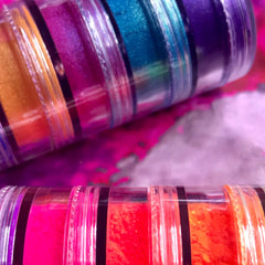 Side view of vegan mineral eyeshadow set showing 6 matte and 6 shimmery stacks in vibrant rainbow colors