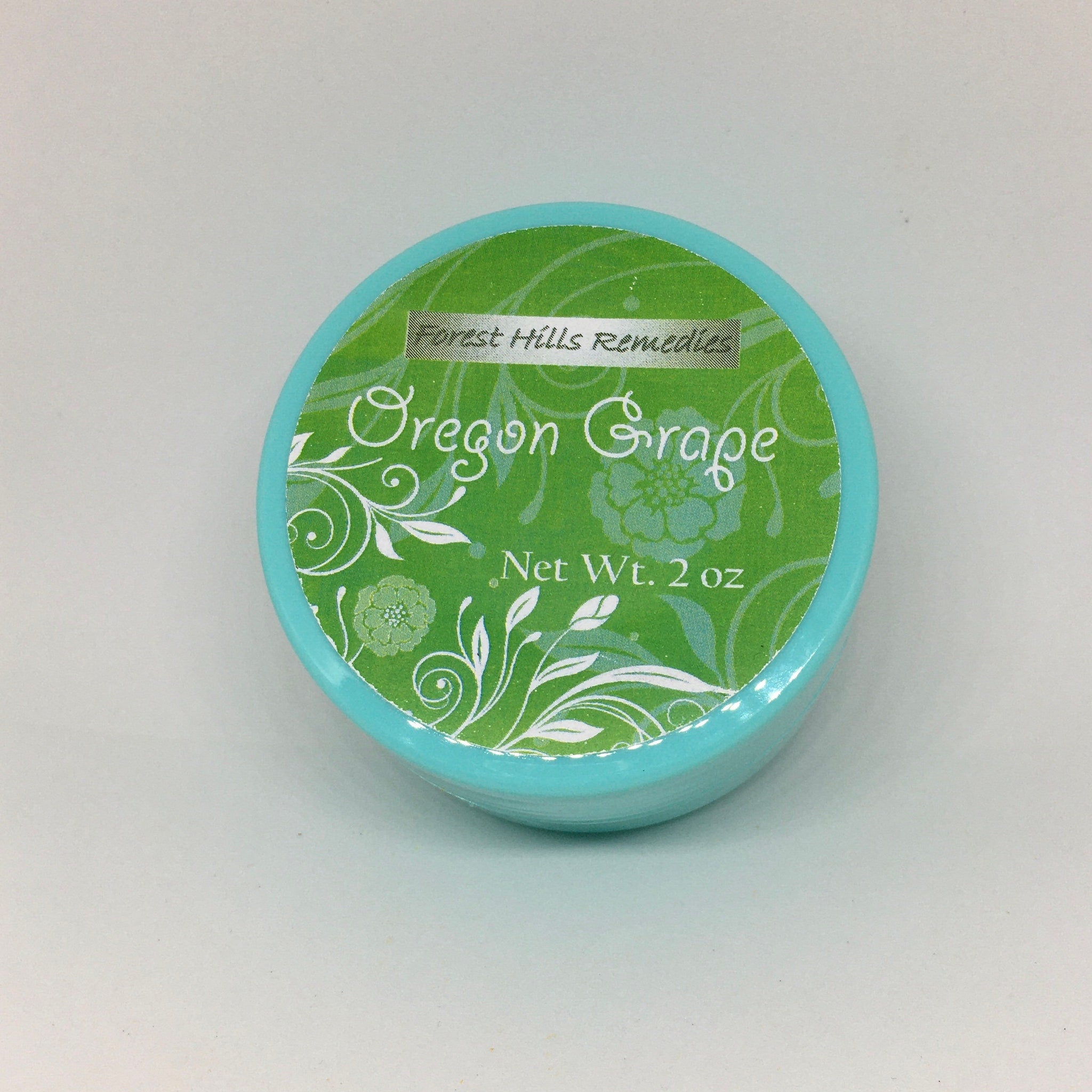 Hand applying all-natural Oregon grape cream with mahonia aquifolium onto clean skin