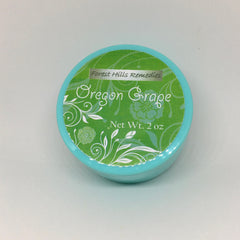 Hand applying all-natural Oregon grape cream with mahonia aquifolium onto clean skin