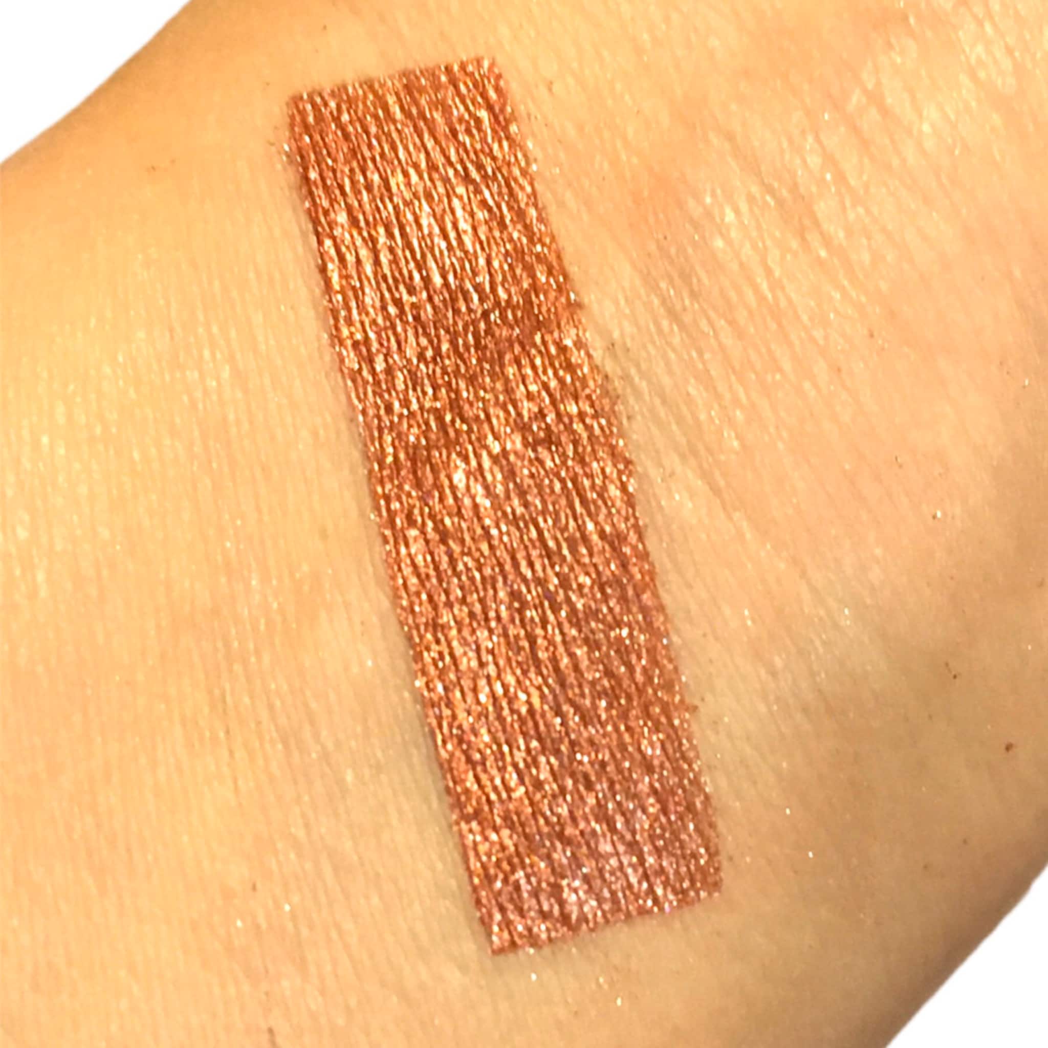Eyeshadow swatch, bronze metallic, textured finish, applied on skin