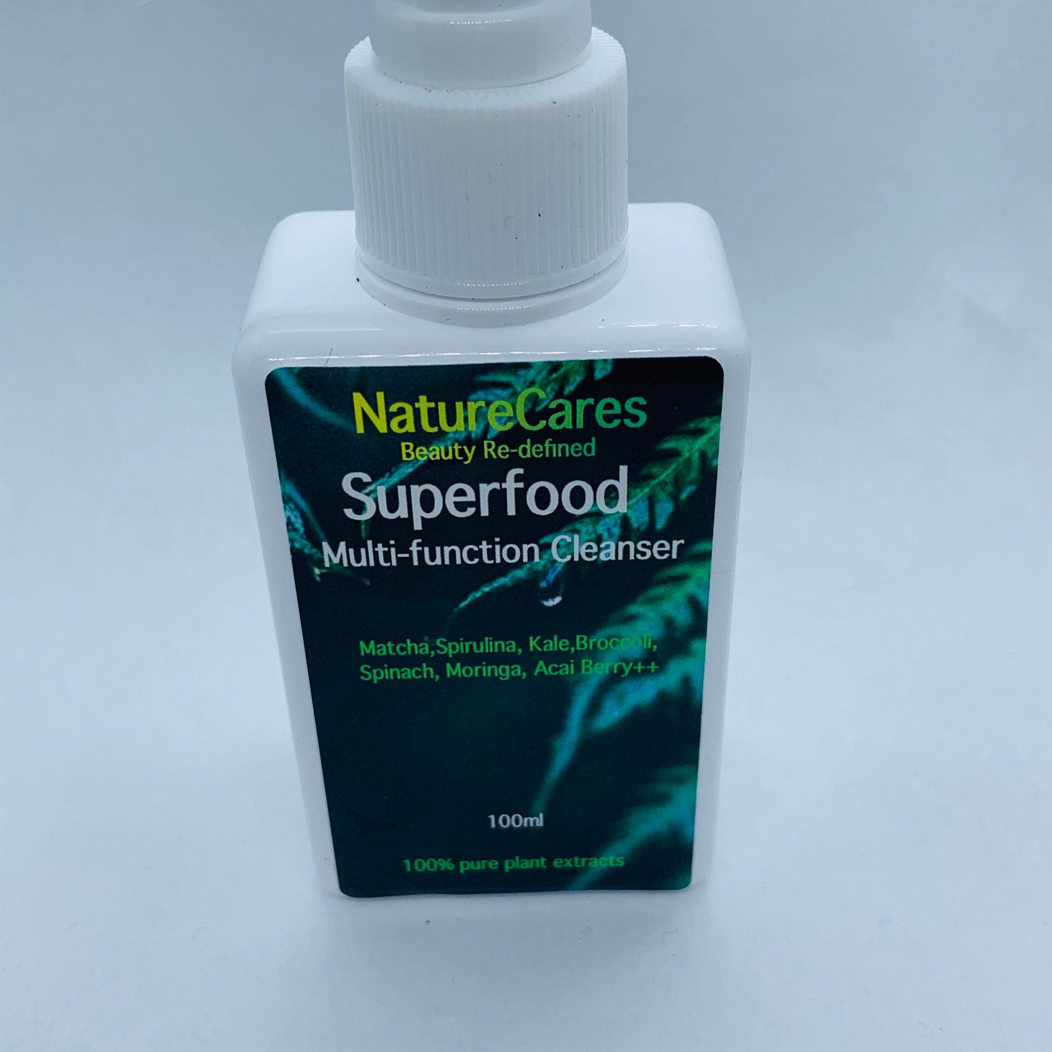 Multi-function cleanser bottle, white plastic, green and black label with NatureCares text