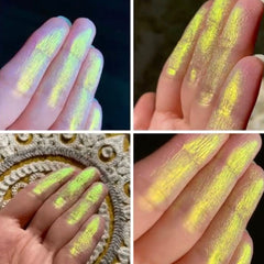 Close-up of iridescent eyeshadow pan showing shifting radioactive hues in a 26mm round compact