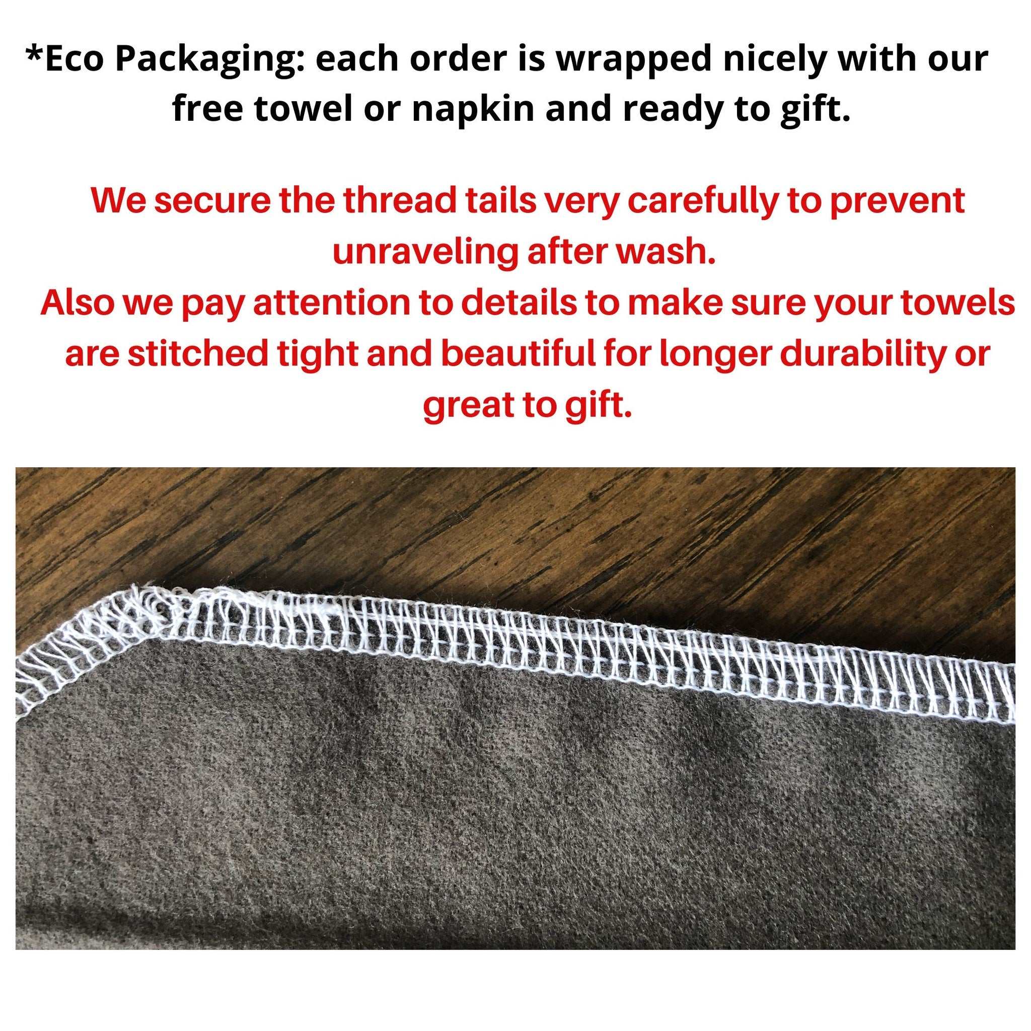 Gray fabric with white stitched edge, close-up detail of towel construction