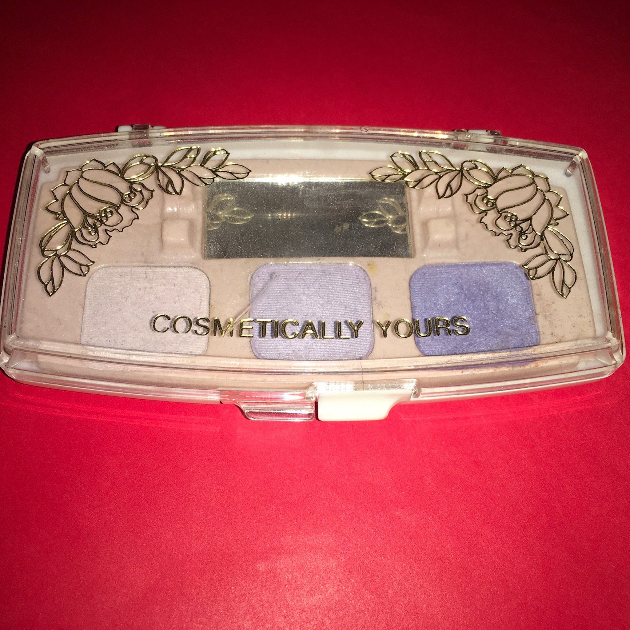 Cosmetically Yours Eye Shadow Palette featuring 12 vibrant matte and shimmer shades in a sleek black compact