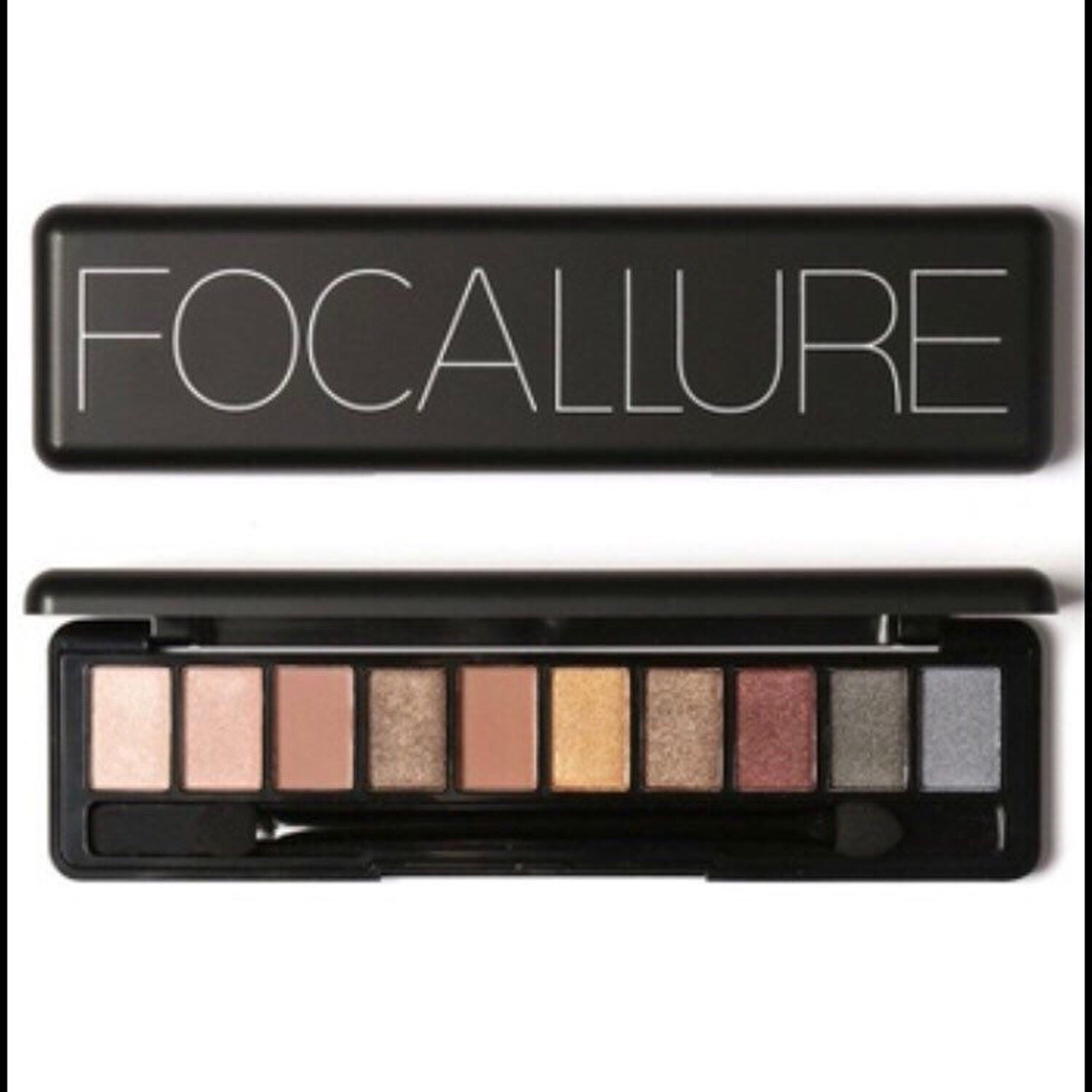 Close-up of matte and shimmer eyeshadow pans in neutral brown and taupe shades with smooth pigmented texture