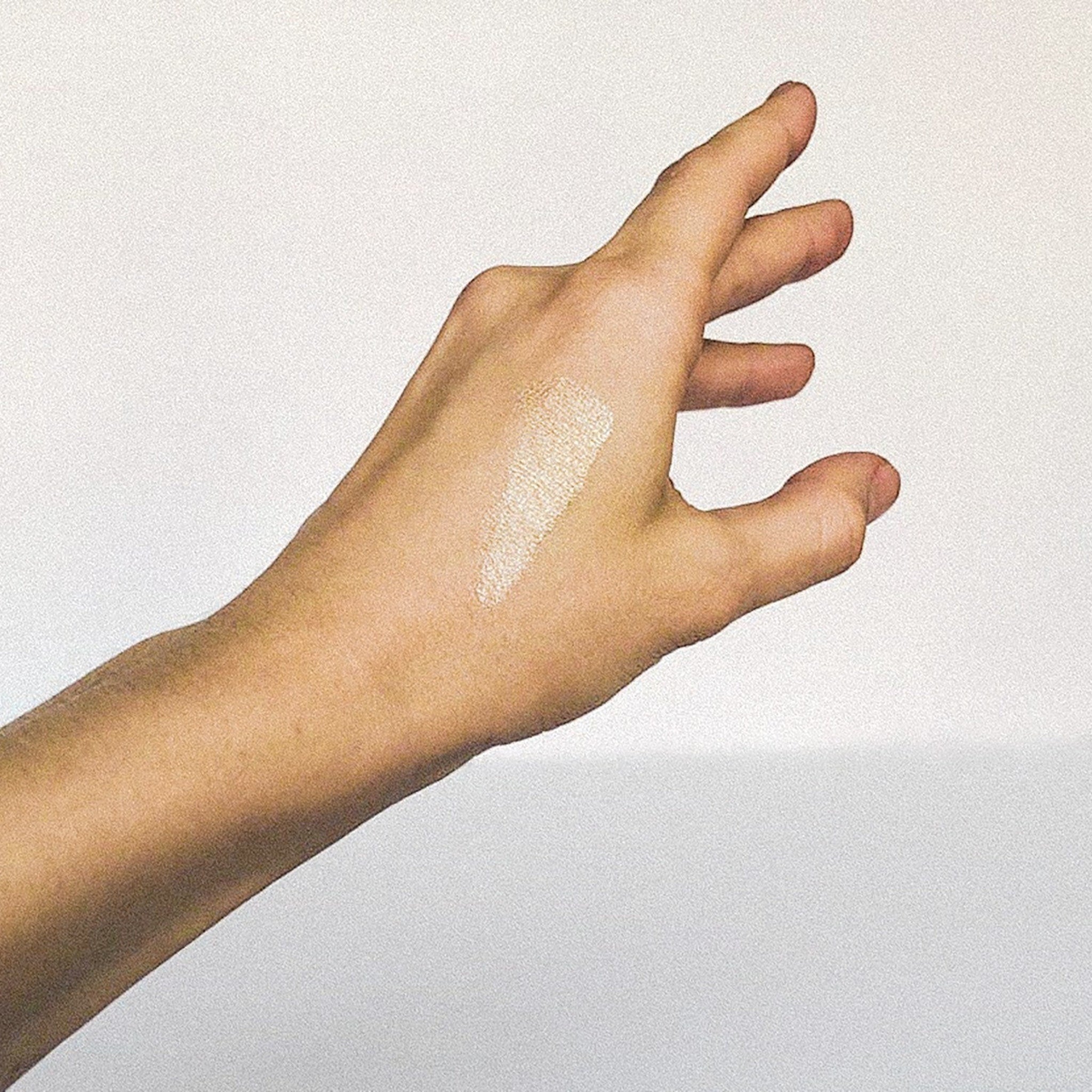 Close-up of champagne shimmer eyeshadow with sparkling mica particles in golden-peach tones